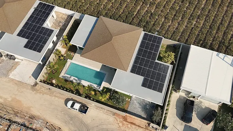 Aerial view of a finished roof with solar panels