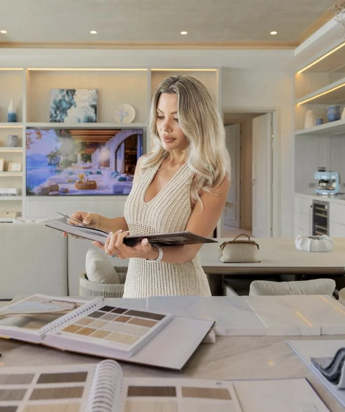 Jessica Green reviewing interior plans in a finished villa